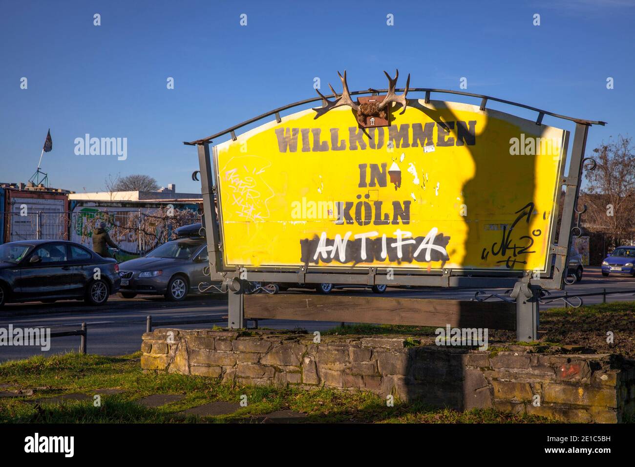 the sign of a former inn was transformed into an unusal town entrance sign with antlers, translation: Welcome to Cologne, Alteburger Strasse, Cologne, Stock Photo