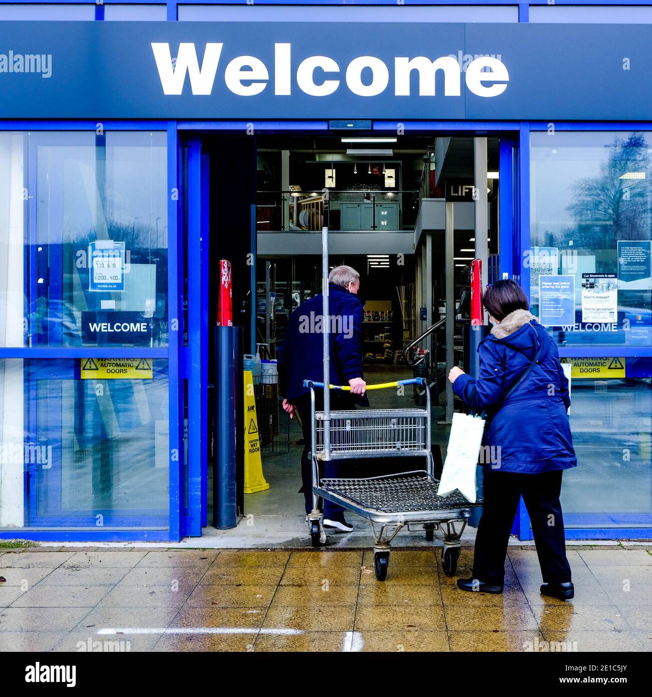 Epsom Surrey, London UK January 06 2021, Couple Entering A Wickes Home Improvement DIY Retail Outlet Stock Photo