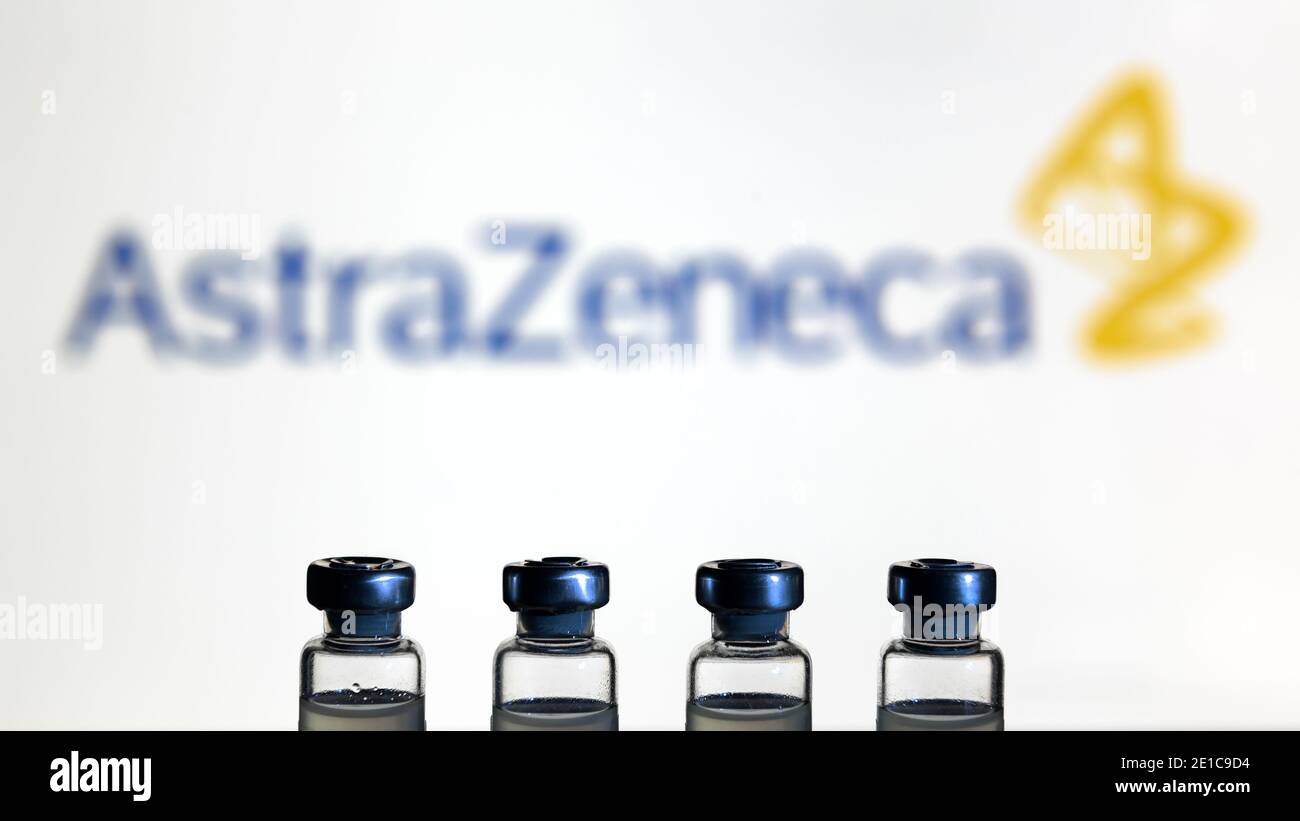 Moscow - Jan 5, 2021: Astrazeneca COVID-19 vaccine, medical bottles with vaccine for coronavirus on logo background. Concept of corona virus drug, inj Stock Photo