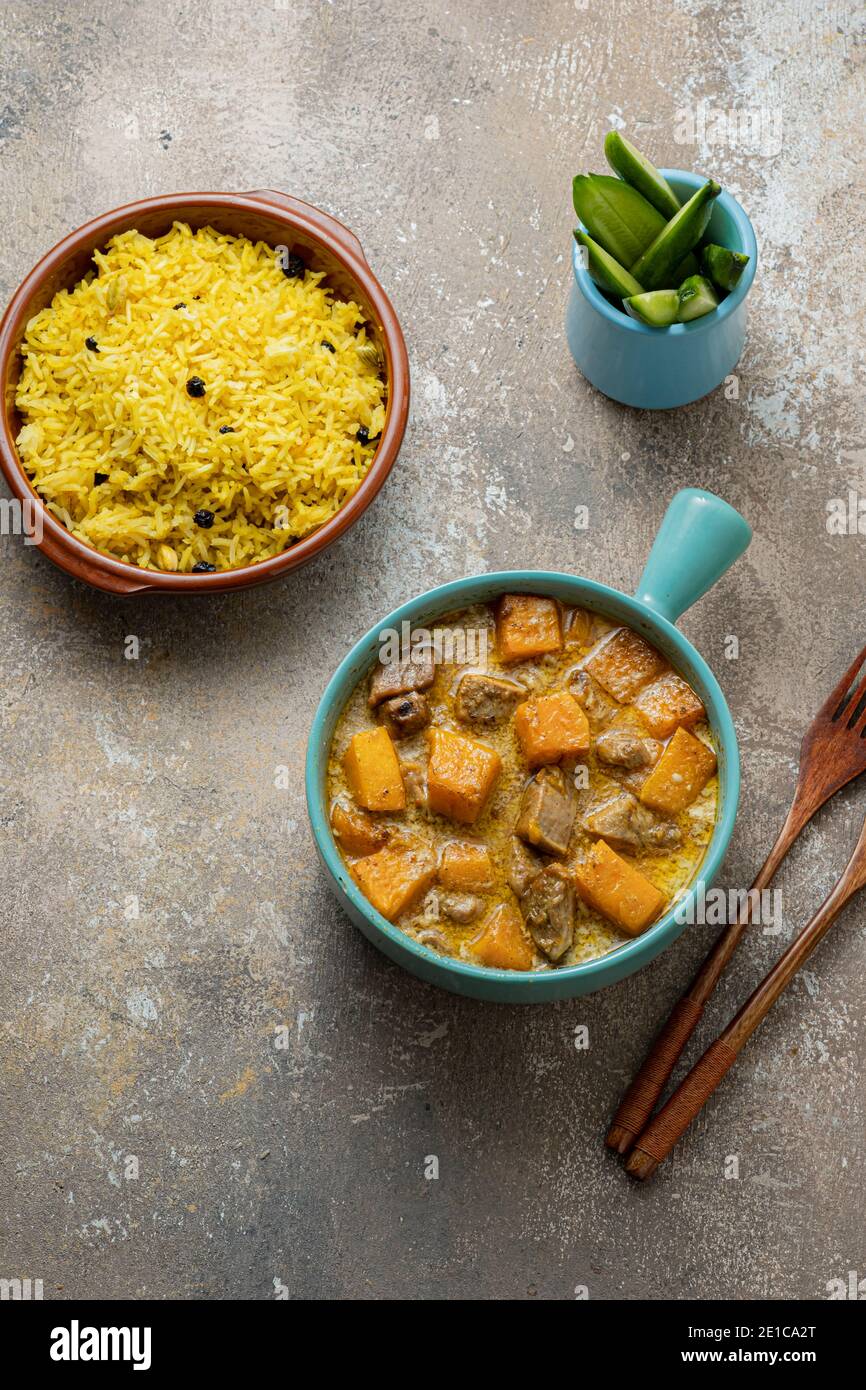 Pumpkin curry with chicken with rice biriani, copy space Stock Photo