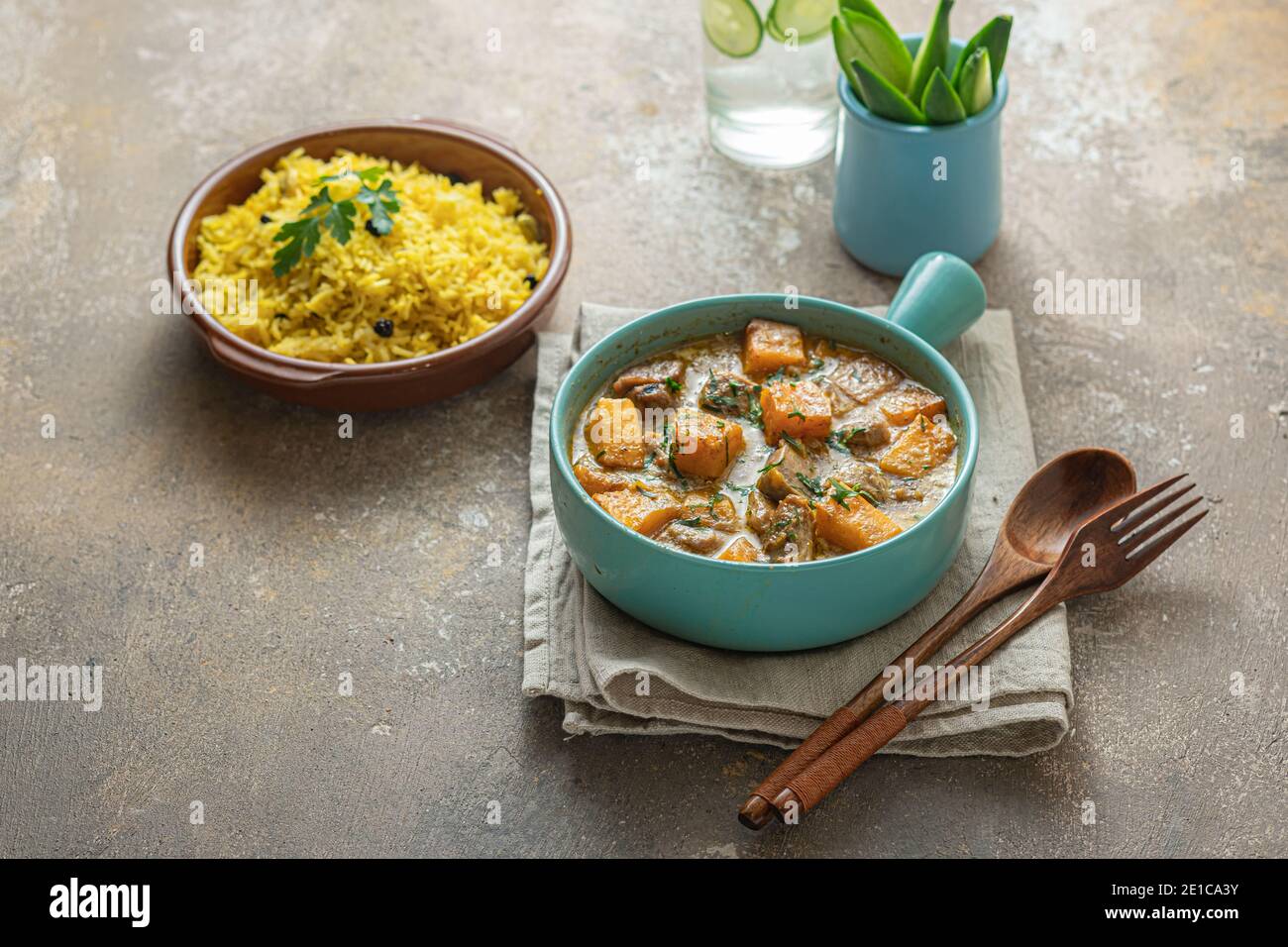 Thai style dinner with pumpkin curry and rice, copy space. Stock Photo
