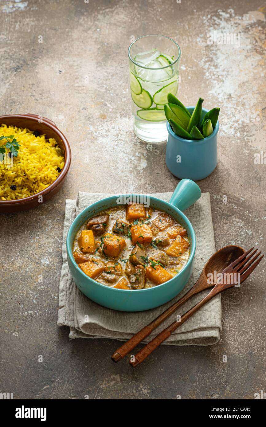 Pumpkin curry with chicken with rice biriani, copy space Stock Photo