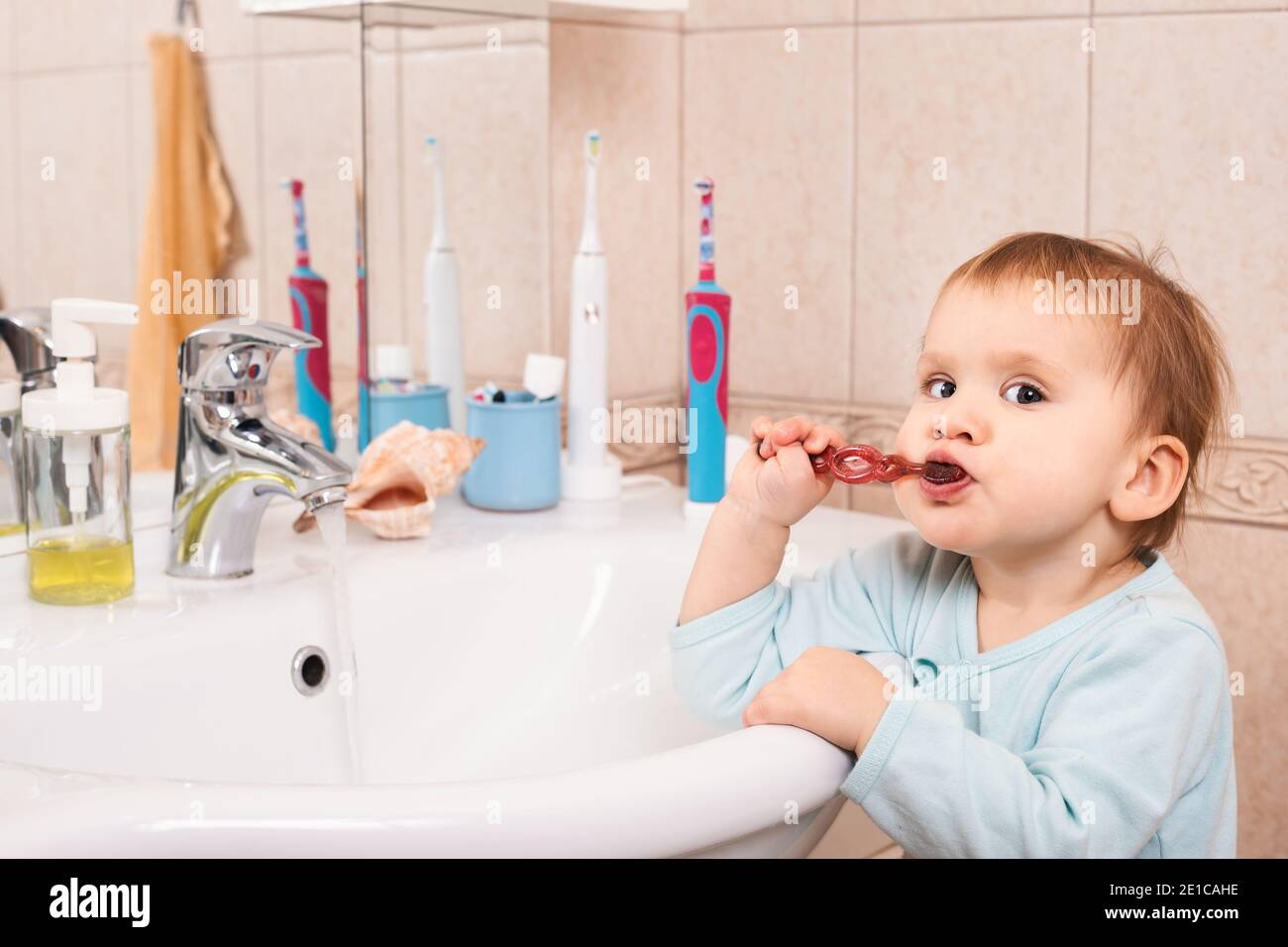 Child brushing teeth sink water hires stock photography and images Alamy