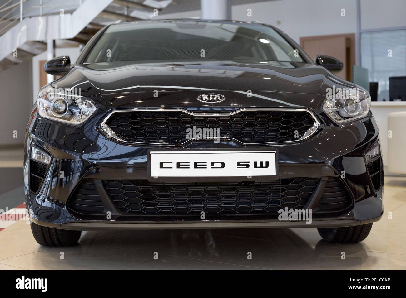Russia, Izhevsk - December 28, 2020: KIA showroom. New Ceed SW car in dealer showroom. Front view. Famous world brand. Stock Photo