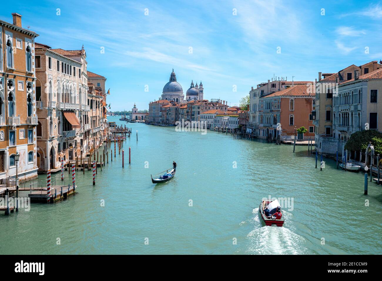 Italian landscape of Venice (Venezia), sunny day on the sea with typical view on canal (water channel). Long exposure method. Stock Photo