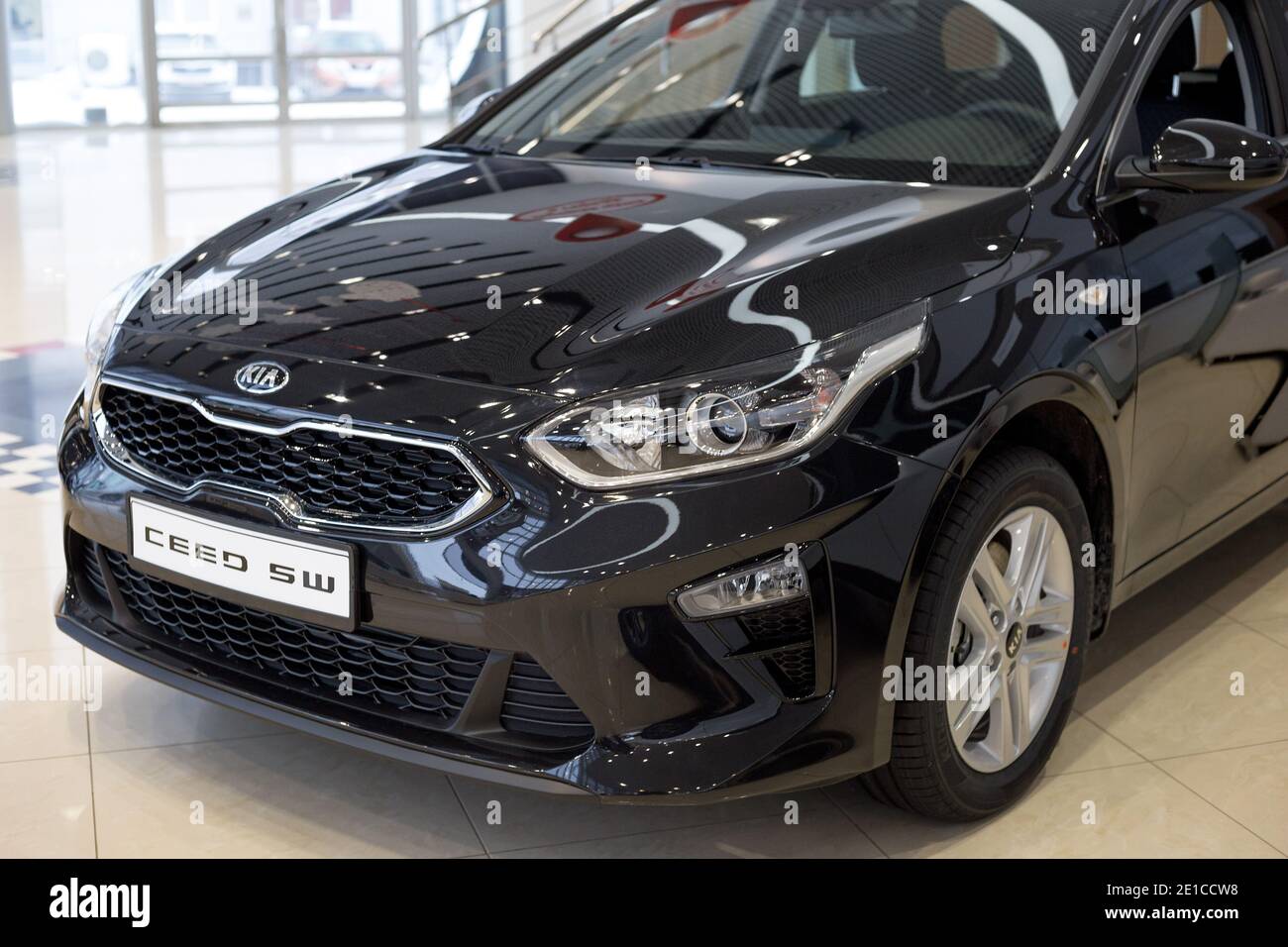 Russia, Izhevsk - December 28, 2020: KIA showroom. New Ceed SW car in dealer showroom. Cropped image. Famous world brand. Stock Photo