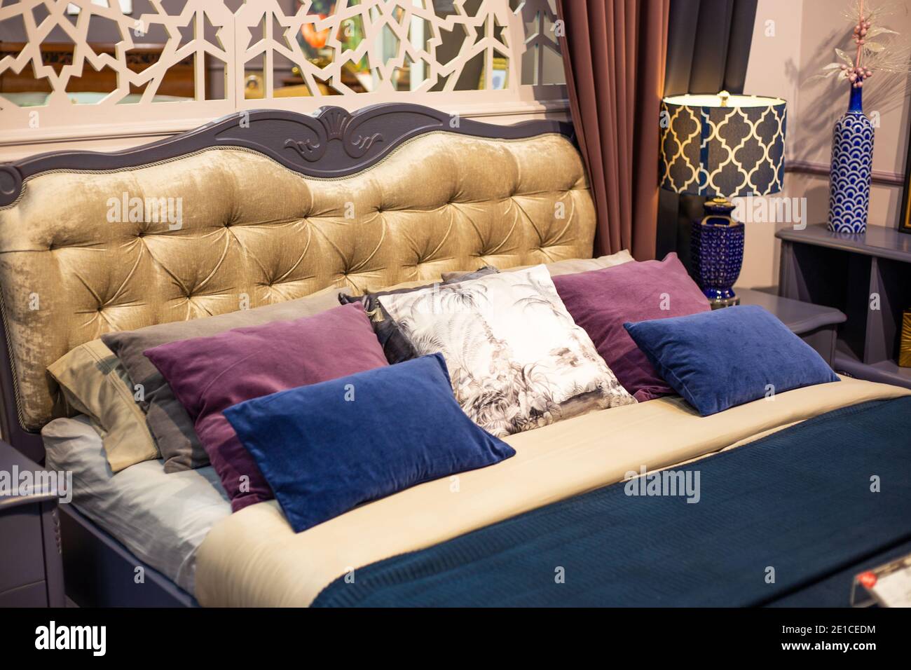 Bedroom interior. Large bed with many pillows. Furniture store Stock
