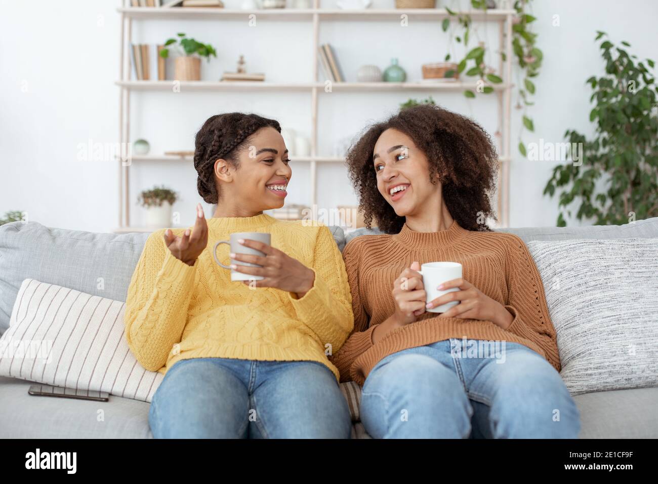 Hot drink, good mood and communication with friend at home Stock Photo