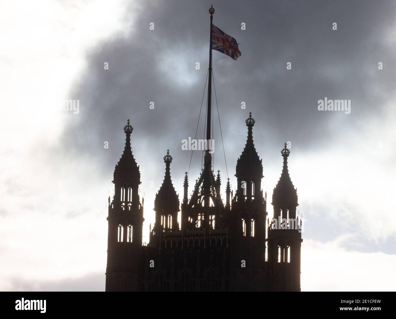 The Tower of Palace of Westminster above the House of Lords with the Union flag flying. Stock Photo