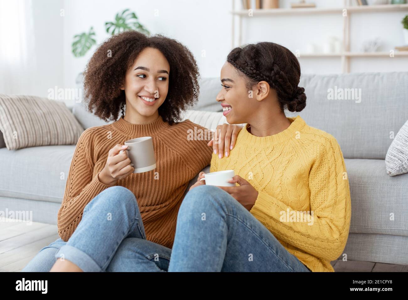 Females communication, gossip and modern date at home Stock Photo