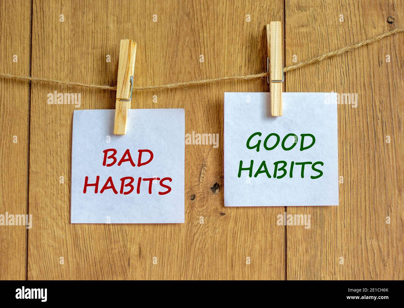 Bad or good habits symbol. Wooden clothespins with white sheets of ...