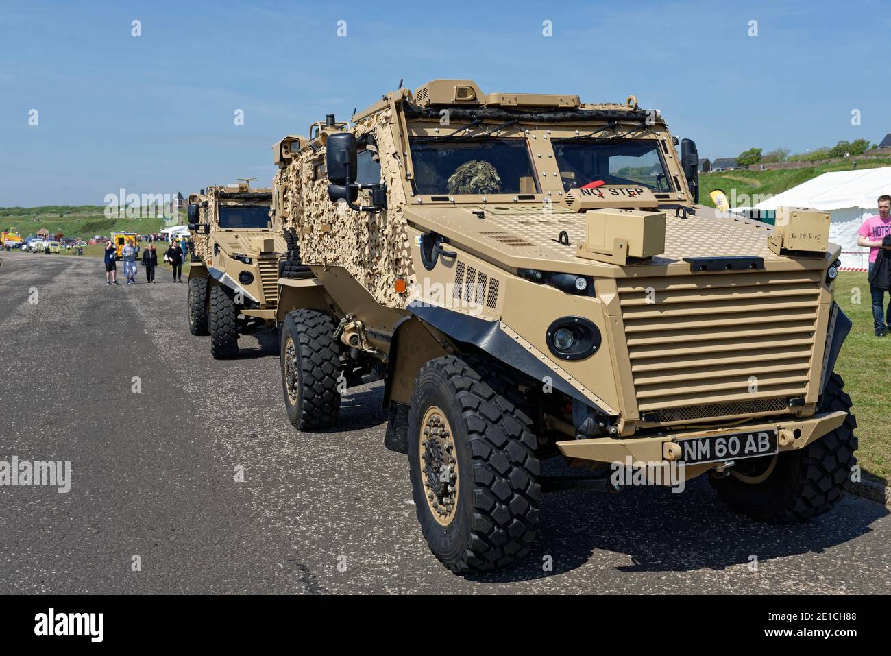 A pair of Army infantry Foxhound armoured Patrol vehicles parked up at the Festival of HeroÕs event in Arbroath on a Summers day in July. Stock Photo