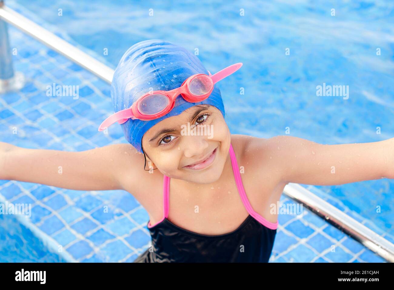 Portrait of a Happy and smiling Indian girl child in the swimming ...