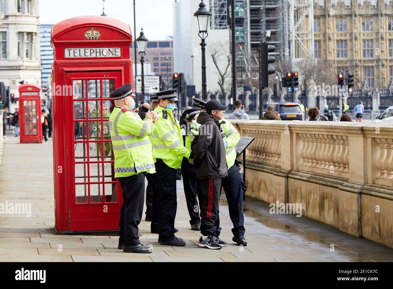 London, UK. - 6 Jan 2021: An anti-lockdown protestor is arrested while attending a protest in Parliament Square against further government coronavirus pandemic  measures. Stock Photo