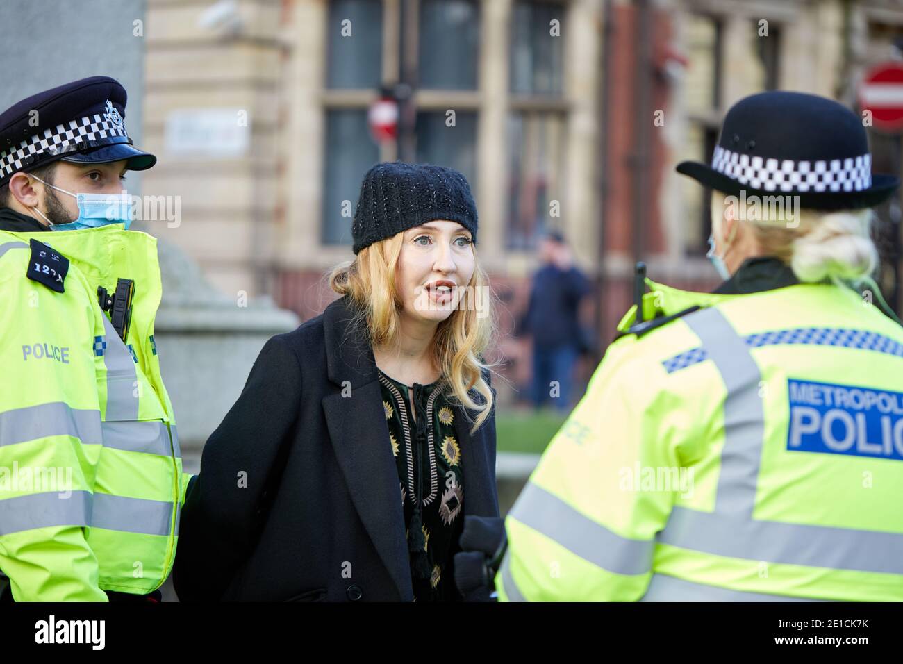 London, UK. - 6 Jan 2021: Anti-lockdown activist Debbie Hicks is arrested while attending a protest in Parliament Square against further government coronavirus pandemic  measures. Stock Photo