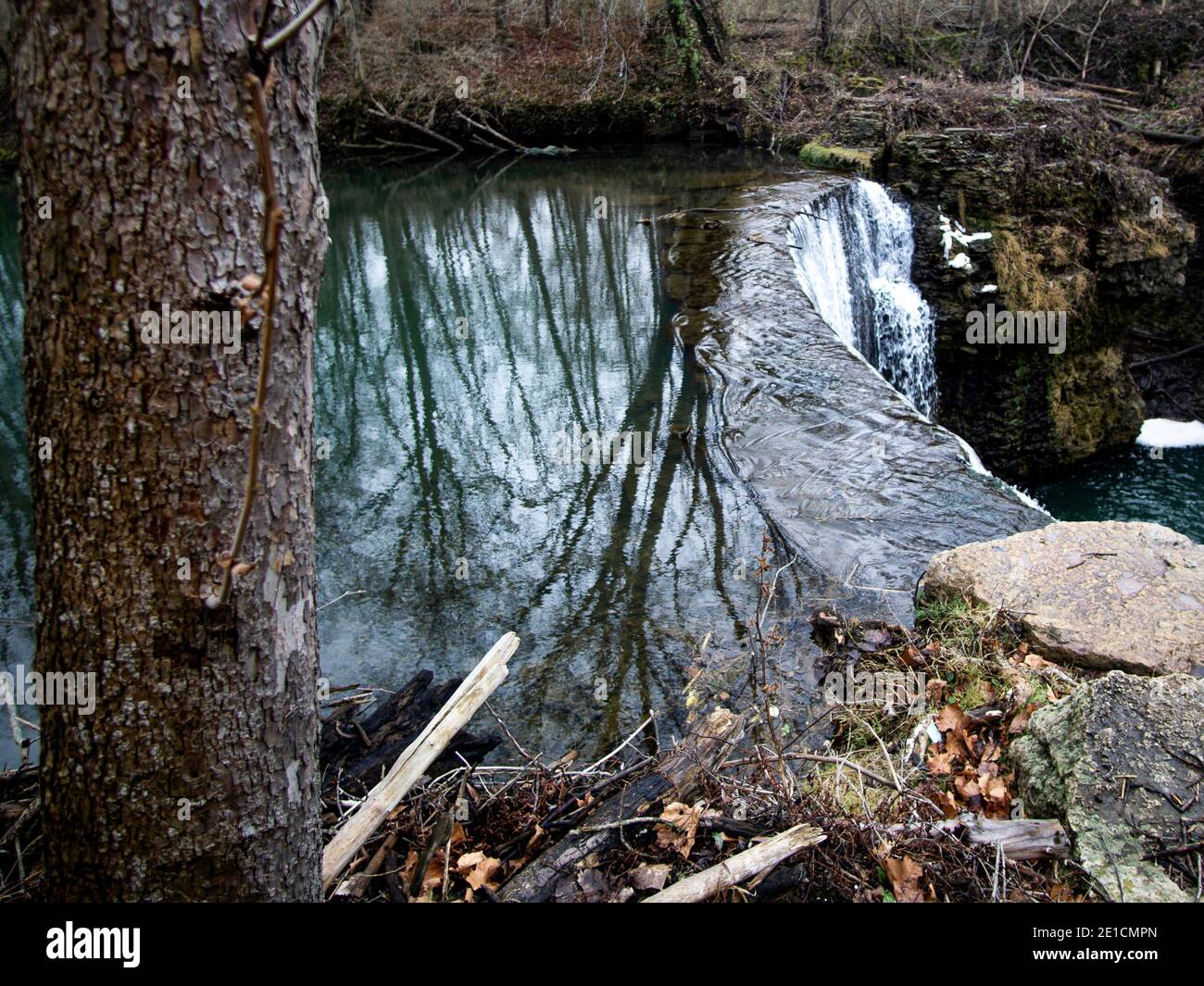 The river flowing over the cliff creating a beautiful waterfall