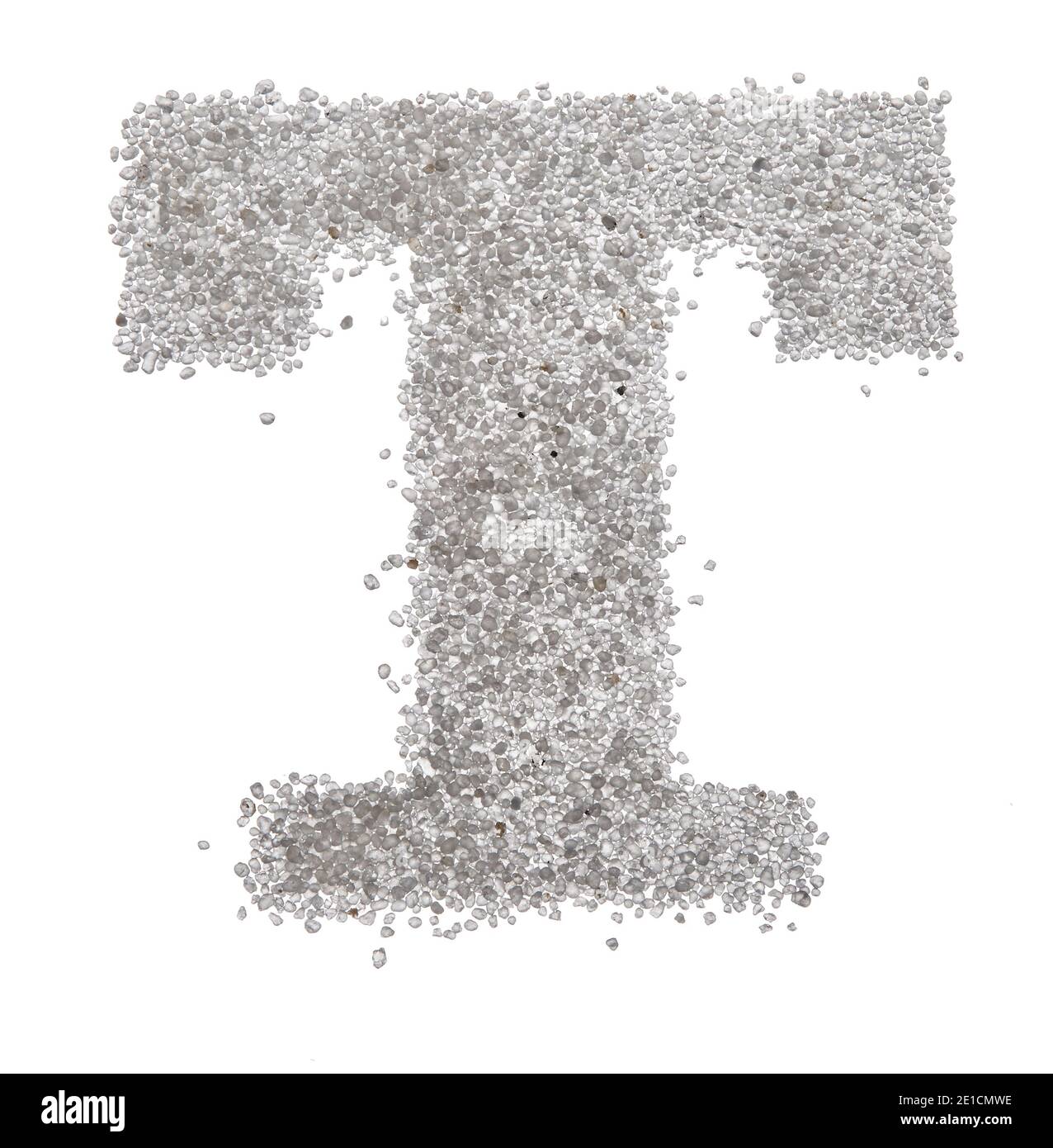 Serif sand letter capital T photographed on a white background Stock Photo