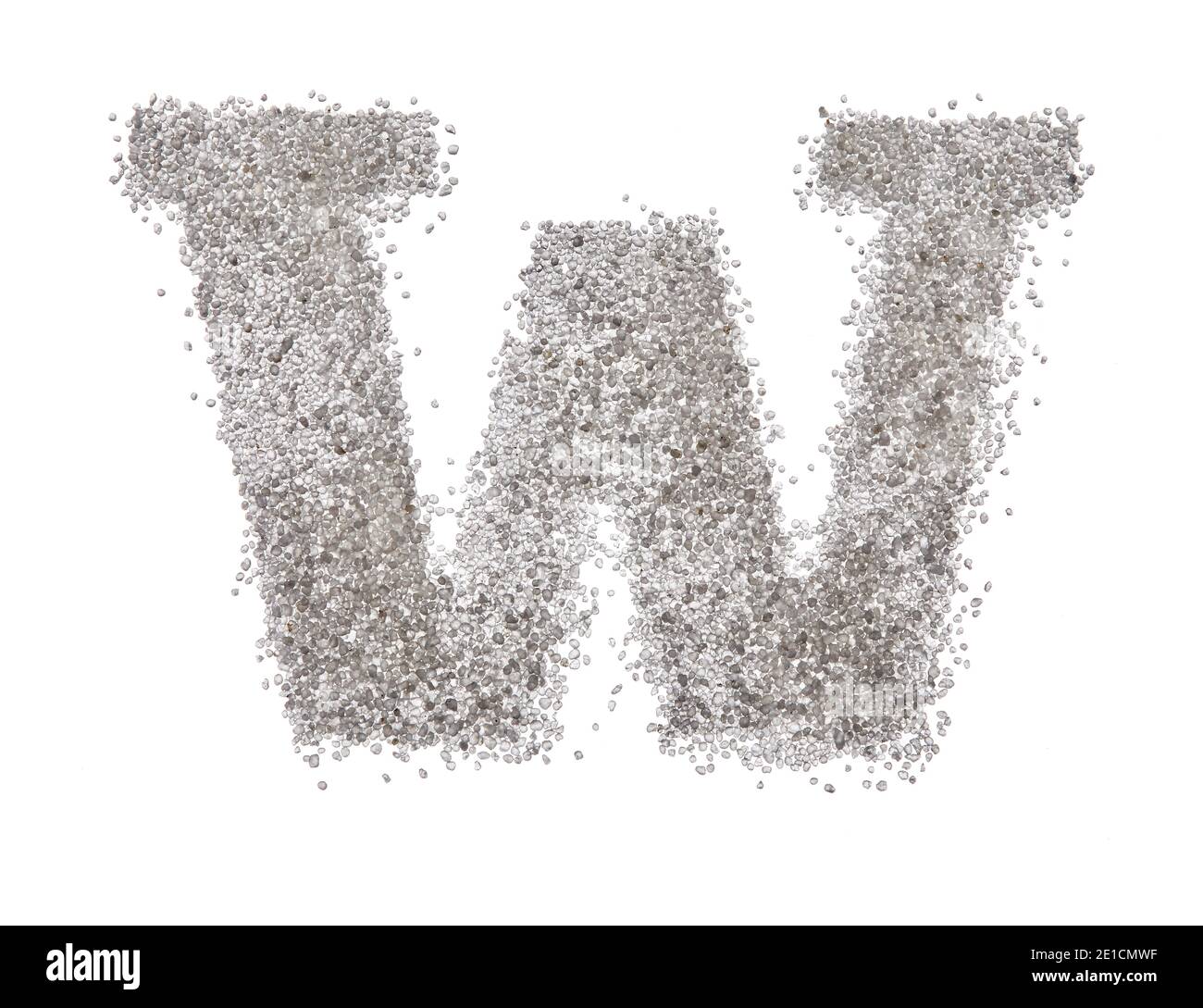 Serif sand letter capital W with hard edges photographed on a white background Stock Photo