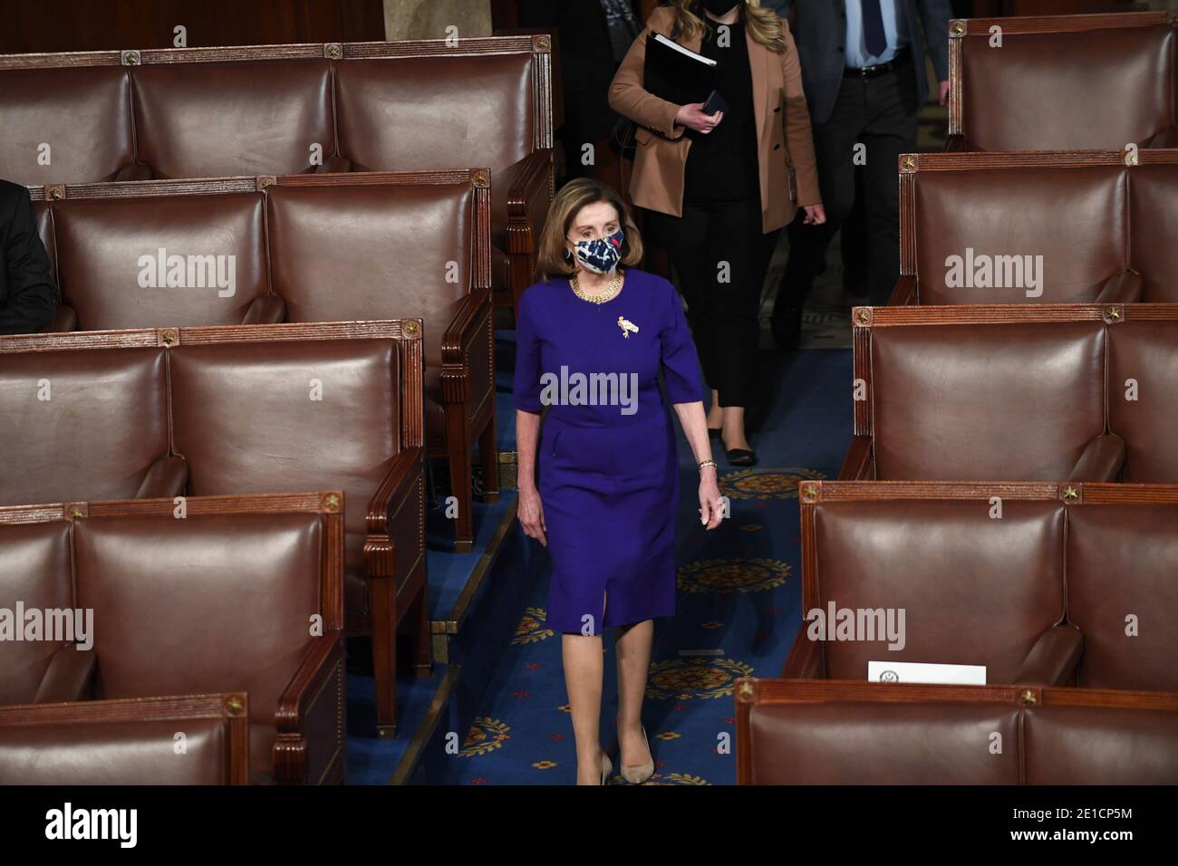 Washington, United States. 06th Jan, 2021. Speaker of the House Nancy Pelosi, D-CA, enters the chamber at the U.S. Capitol in Washington, DC on Wednesday, January 6, 2021. A joint saession of Congress counts the Electoral College votes today. Photo by Pat Benic/UPI Credit: UPI/Alamy Live News Stock Photo