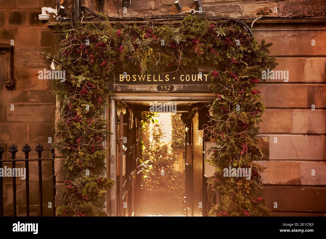 BOSWELL'S COURT, the entrance to The Witchery Restaurant, along the royal mile in Edinburgh, lit up at Christmas time. Stock Photo