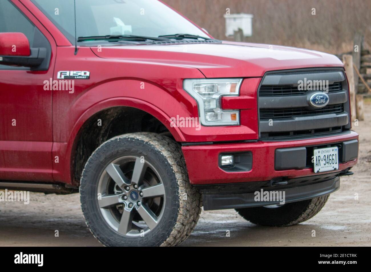 Leamington Canada, January 05 2021: Editorial photograph of a ford F150 with large winter tires that are all muddy from off road driving. Ford f150 is Stock Photo