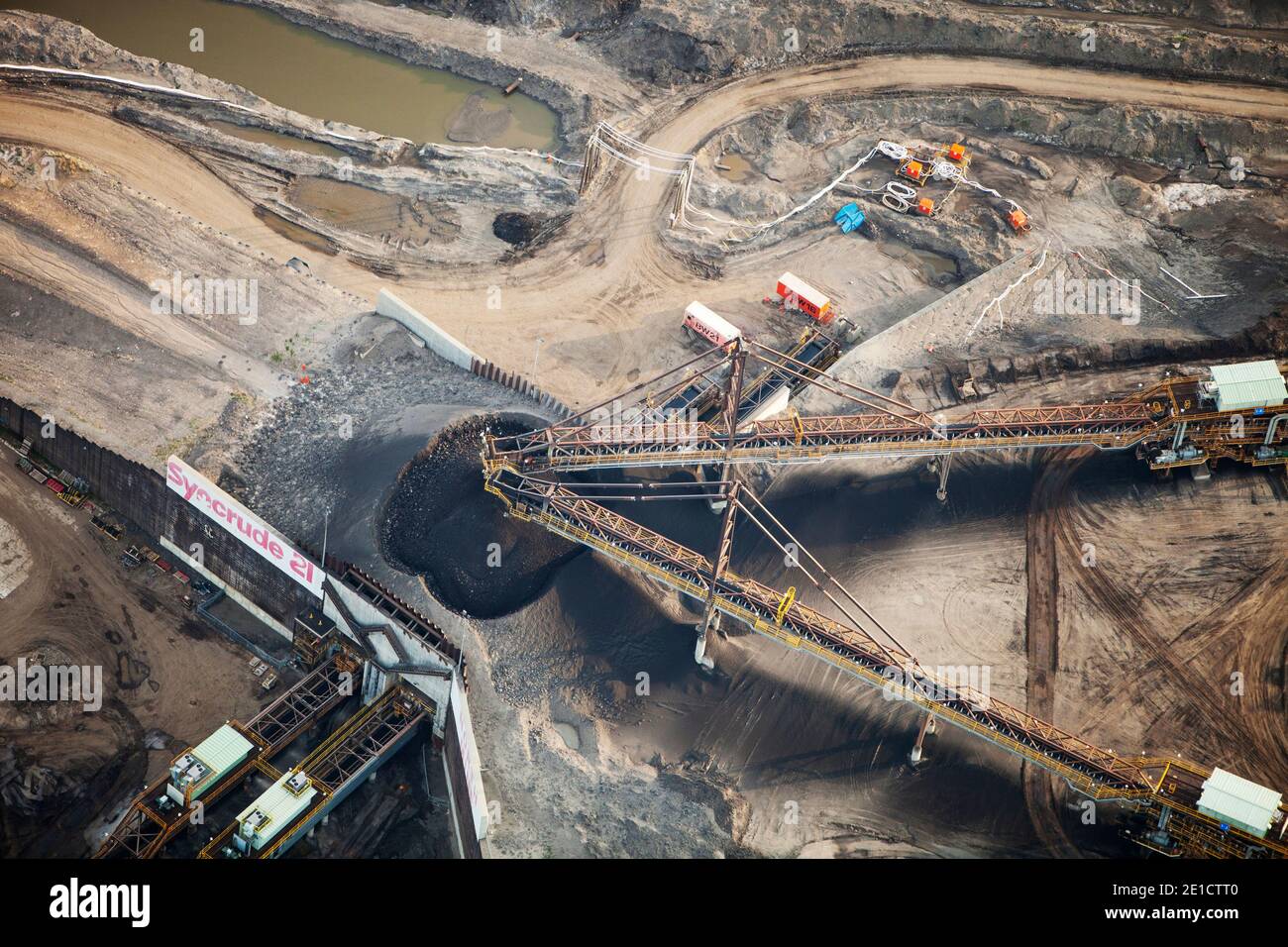 Tar sands deposits being mined north of Fort McMurray, Alberta, Canada. The tar sands are the largest industrial project on the planet, and the world' Stock Photo