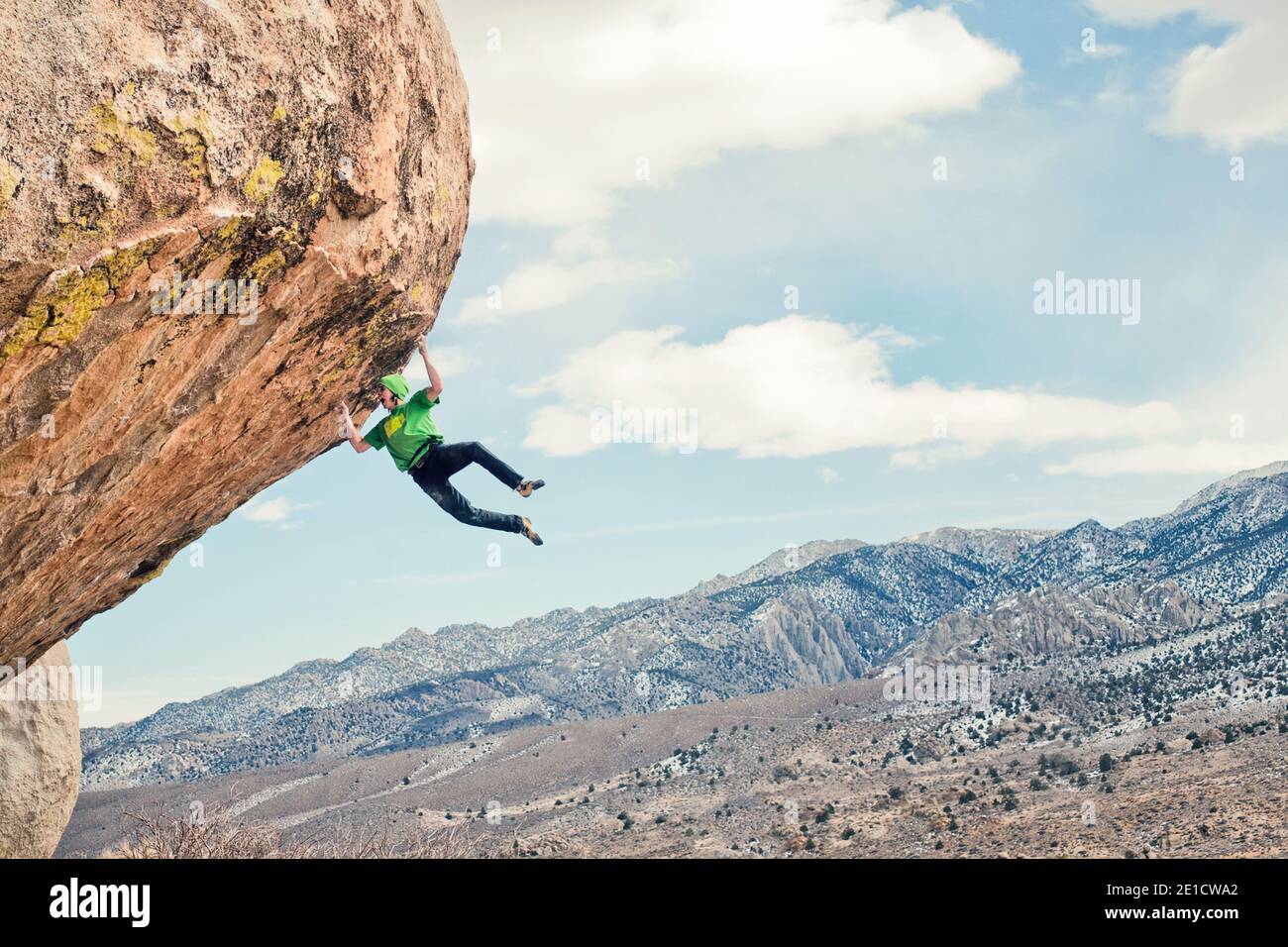 Rock climber hanging from cliff hi res stock photography and