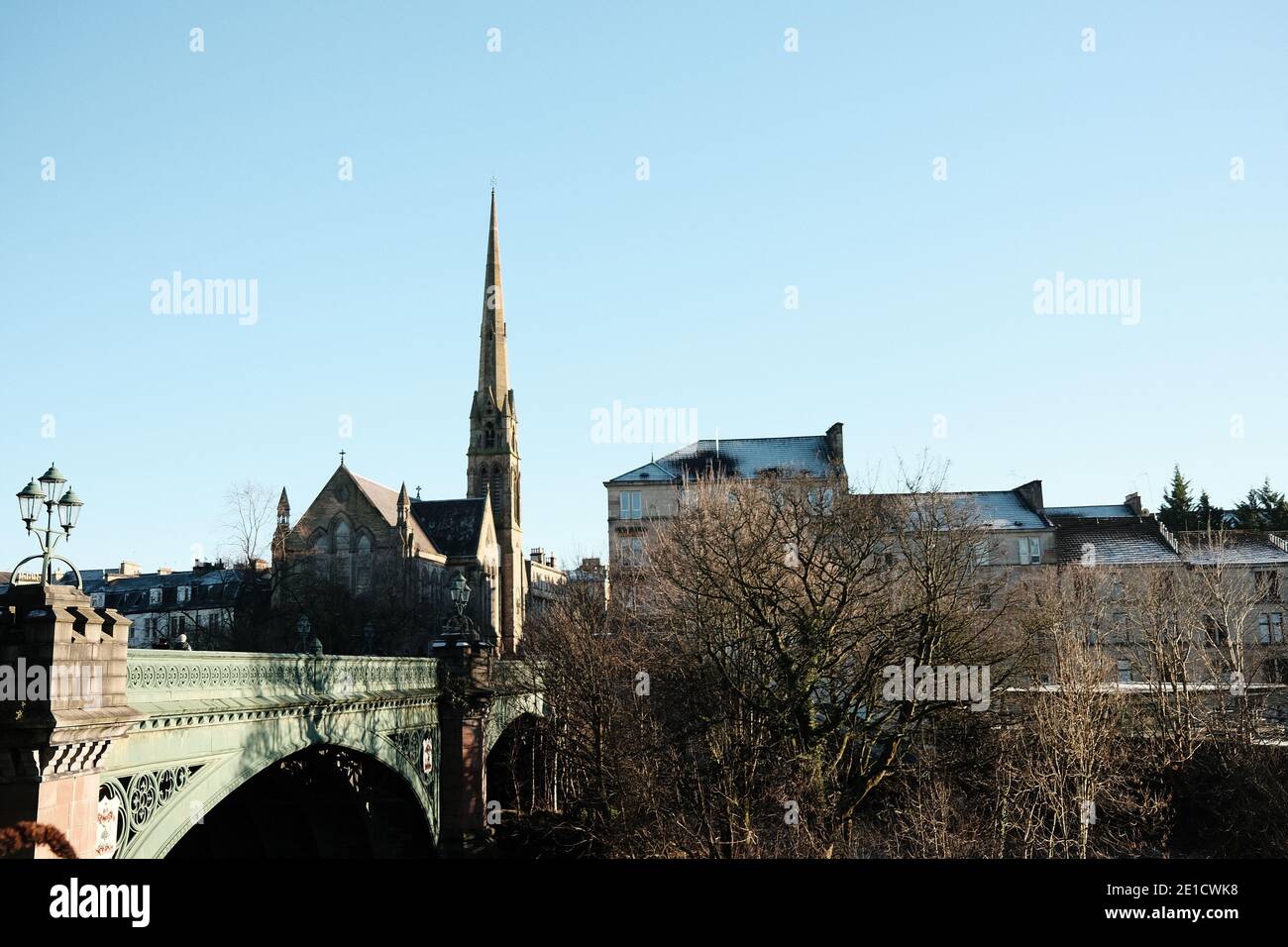 Glasgow skyline at Kelvinbridge, with church spire and bridge over River Kelvin. Scotland Stock Photo