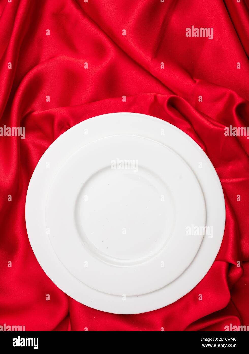 Valentines dinner concept. Vertical top view of empty set white plates ...