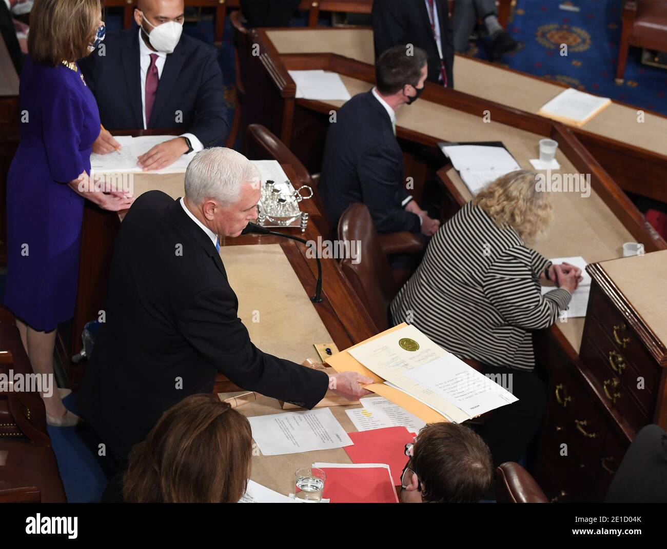 Washington, United States. 06th Jan, 2021. Vice President Mike Pence receives written objections from the State of Arizona to certification of the state's Electoral College votes during a joint session of Congtess the U.S. Capitol in Washington, DC on Wednesday, January 6, 2021. Congress counts the Electoral College votes today in a joint session. Photo by Pat Benic/UPI Credit: UPI/Alamy Live News Stock Photo