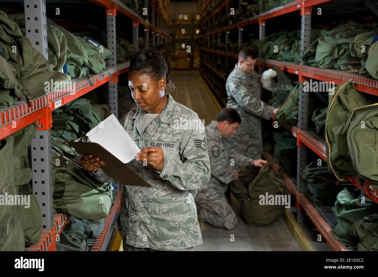 A U.S. Air Force Staff Sgt. takes inventory of the military issued gear on the deployment line Stock Photo