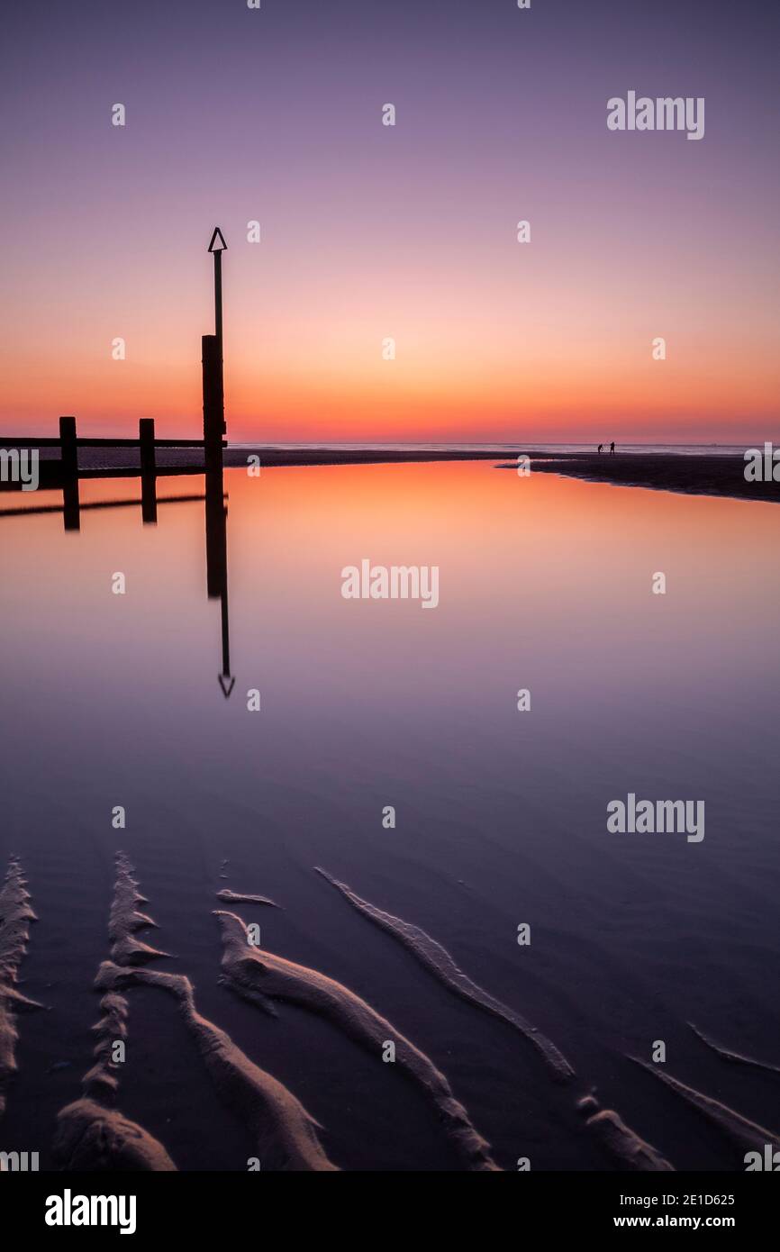 Rhyl beach at sunset on the North Wales coast Stock Photo