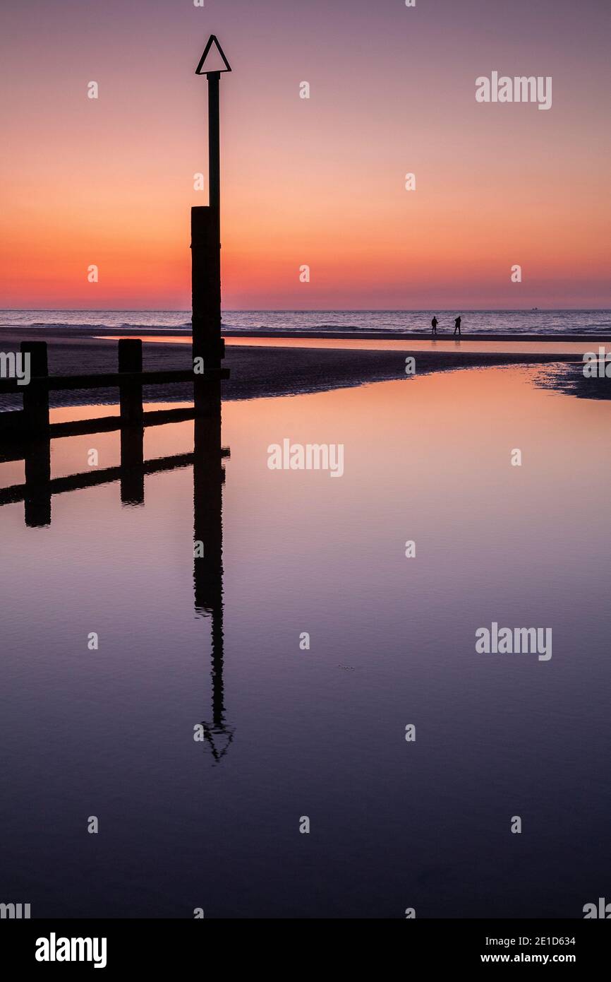 Rhyl beach at sunset on the North Wales coast Stock Photo