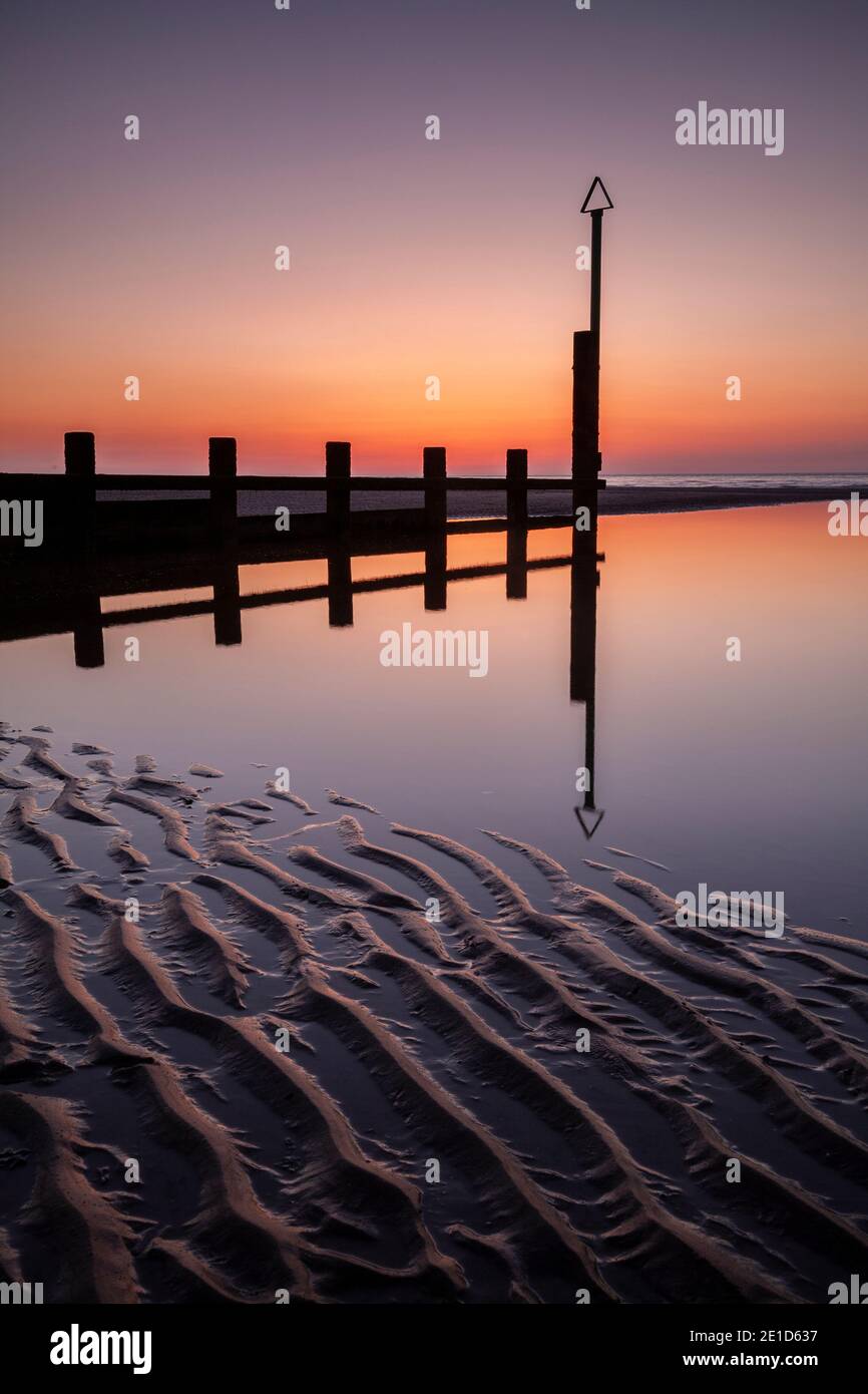 Rhyl beach at sunset on the North Wales coast Stock Photo