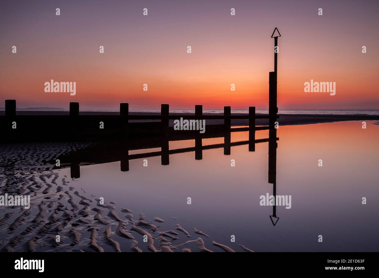 Rhyl beach at sunset on the North Wales coast Stock Photo