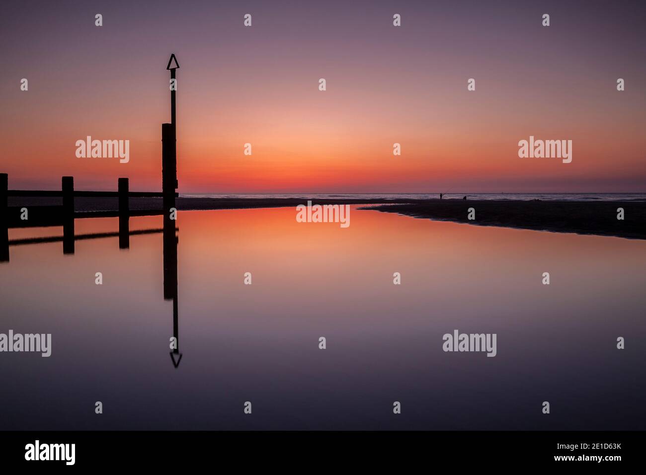 Rhyl beach at sunset on the North Wales coast Stock Photo