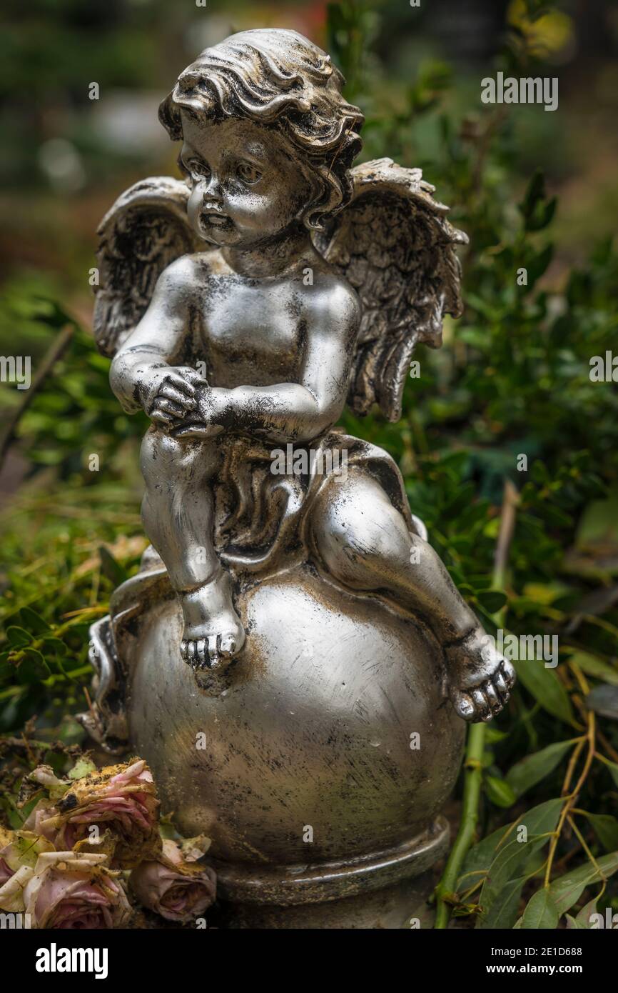 angel statue on an old grave Stock Photo