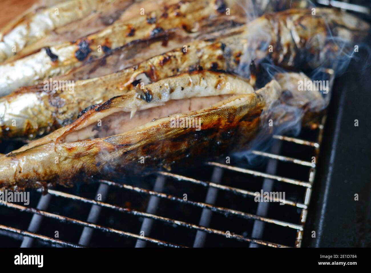 Barbecue with fish. Grilled mackerel fish. Fatty, oily fish is an