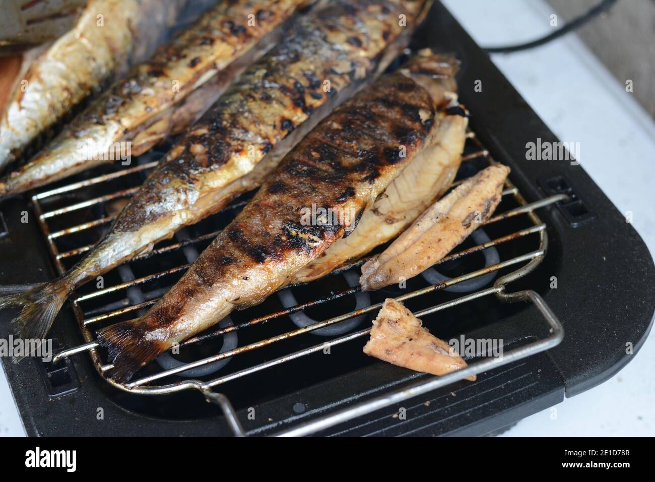 Barbecue with fish. Grilled mackerel fish. Fatty, oily fish is an