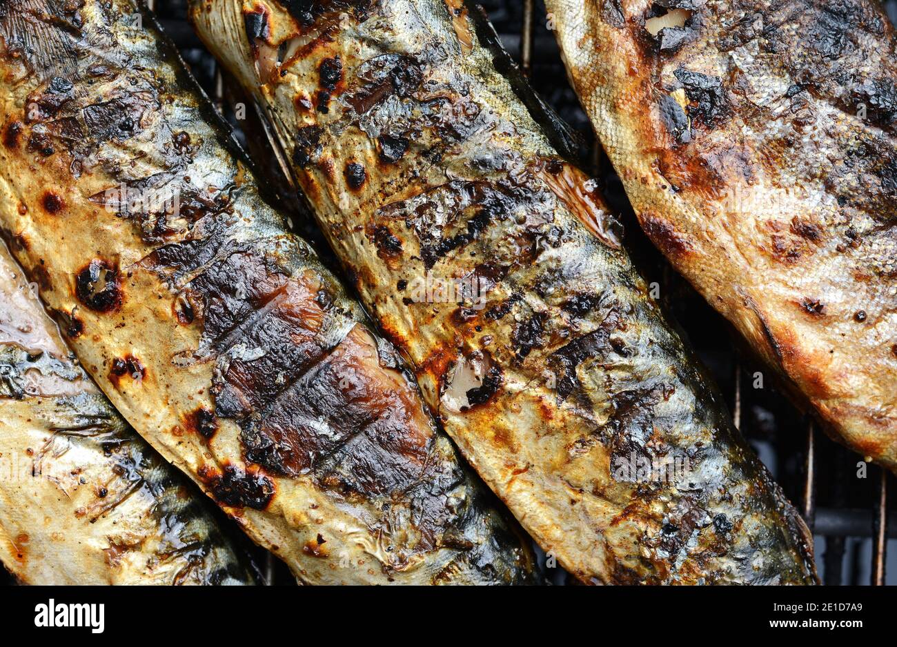 Barbecue with fish. Grilled mackerel fish. Fatty, oily fish is an