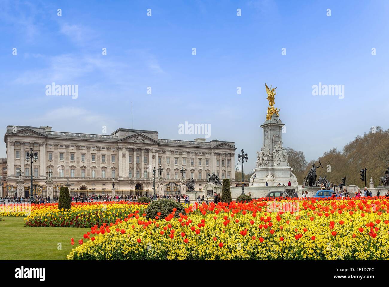 The outside of Buckingham Palace in London, England showing the main Palace, Victoria Memorial and flowers. Stock Photo