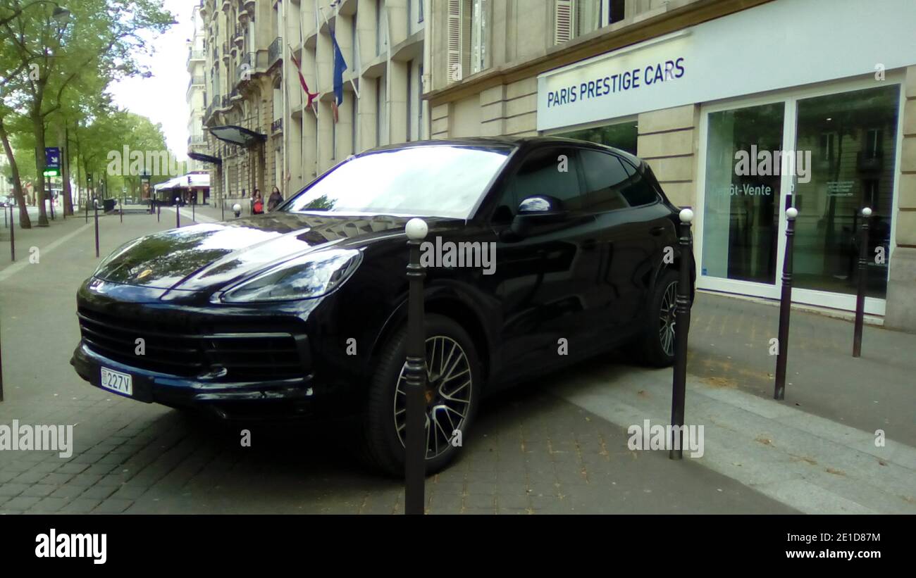 Paris, France - jan 2018: porche cayenne parked in front of a dealership on the champs elisee Stock Photo