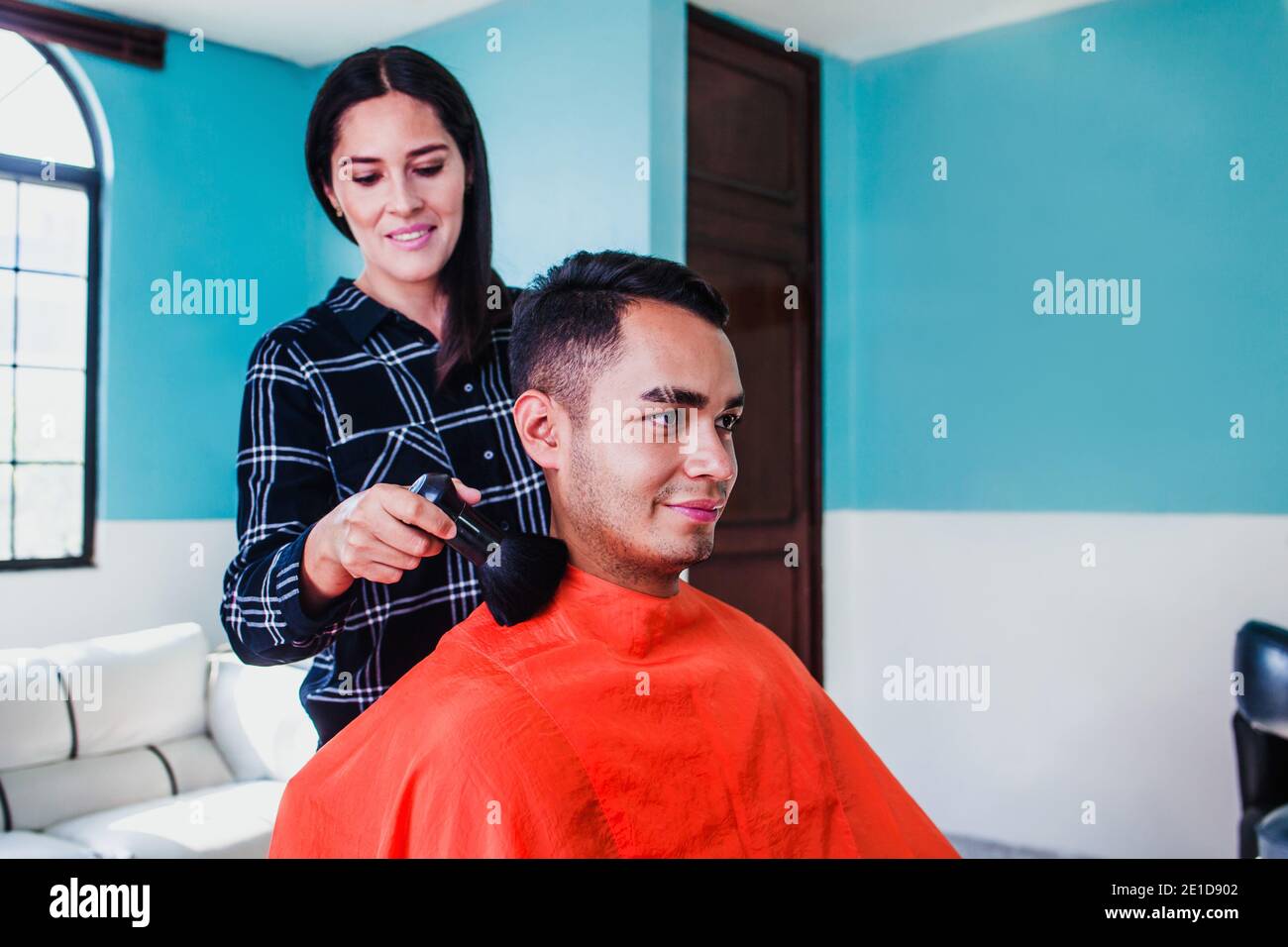 Latin woman who owns her haircut business in Mexico city Stock Photo