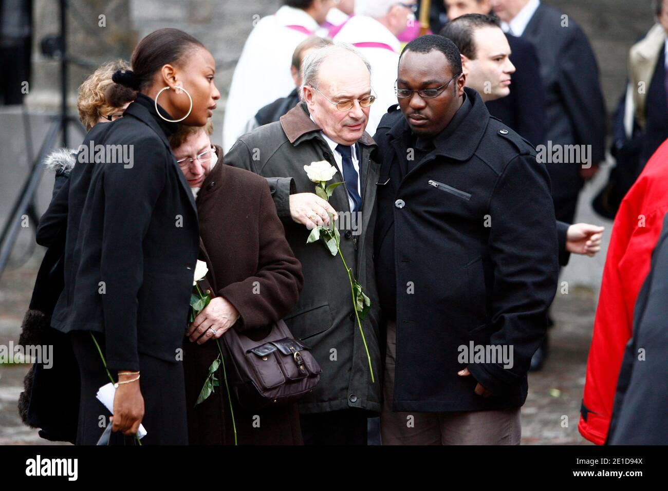 The bride of Antoine de Leocour, Rakia Hassan Kouka of Niger and his father and mother, gather on January 17, 2011 outside the Linselles church during the funeral of the two young Frenchmen abducted by members of Al Qaeda in the Islamic Maghreb (Aqmi) and killed the day after, on January 8, 2011. Photo by Sylvain Lefevre/ABACAPRESS.COM Stock Photo