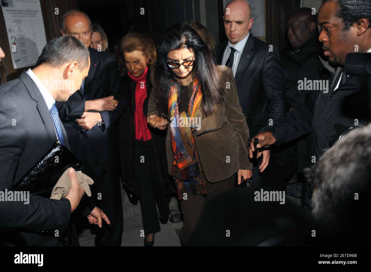 Liliane Bettencourt and her daughter Francoise Bettencourt-Meyers leave