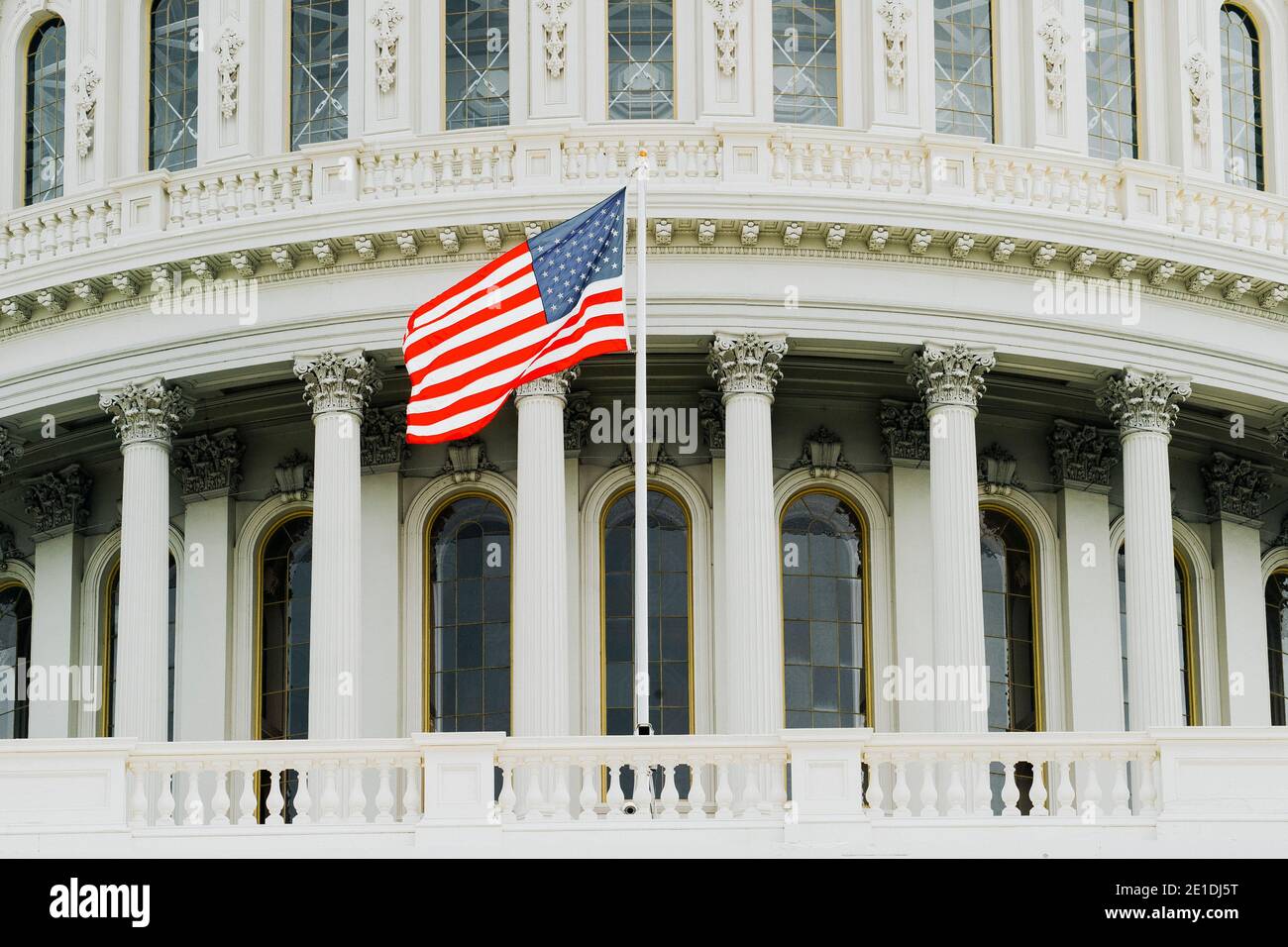 US Capitol Building dome detail with waving national flag - Washington ...