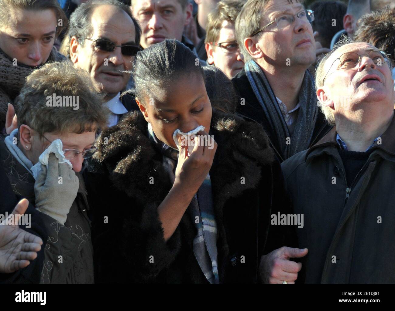 Rakia Kouka, Antoine de Leocour fiancee, Mrs and Mr de leocour attend a ceremony to pay tribute to Antoine de Leocour and Vincent Delory, killed last week in Niger, on January 15, 2011. Photo by Christophe Guibbaud/ABACAPRESS.COM Stock Photo