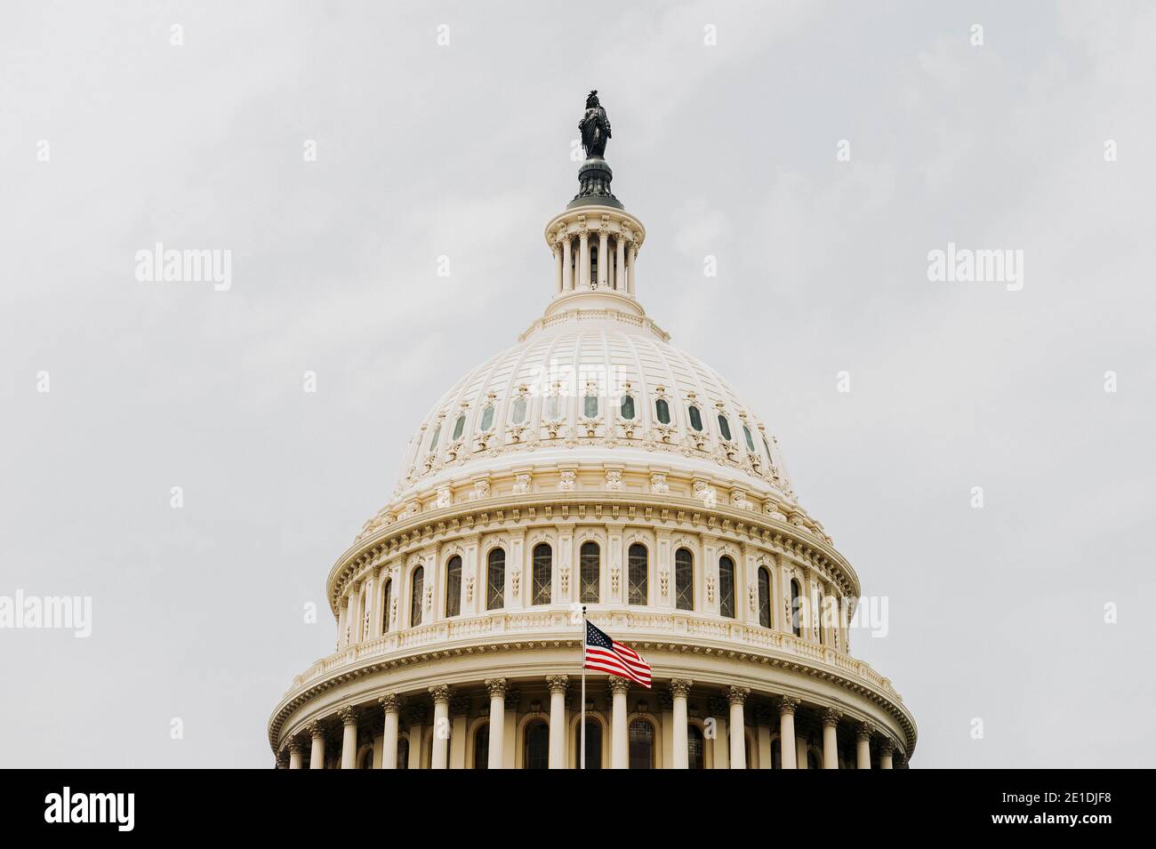 US Capitol Building dome detail with waving national flag - Washington ...