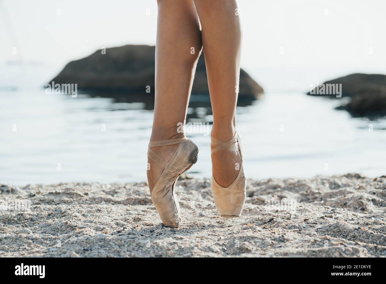 Close Up Of Ballet Dancers Feet She Practices Exercises On Sandy