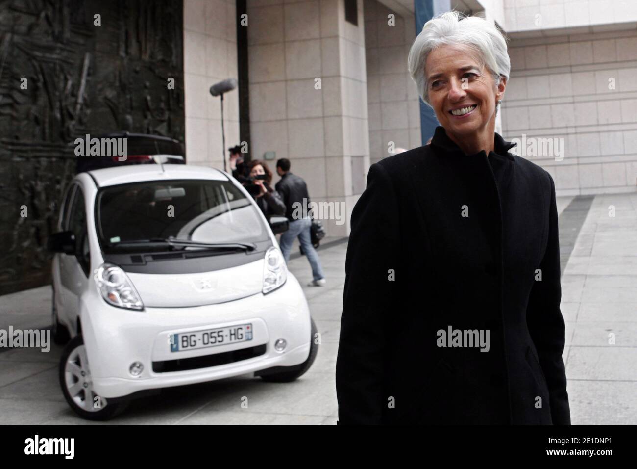 French Minister for the Economy, Finance and Industry Christine Lagarde poses as she drives an Ion Peugeot full electric car, in Paris, France, on January 20, 2011. The Economy ministry will use the four seat four-door city ion car, launched at the end of 2010. Photo by Stephane Lemouton/ABACAPRESS.COM Stock Photo